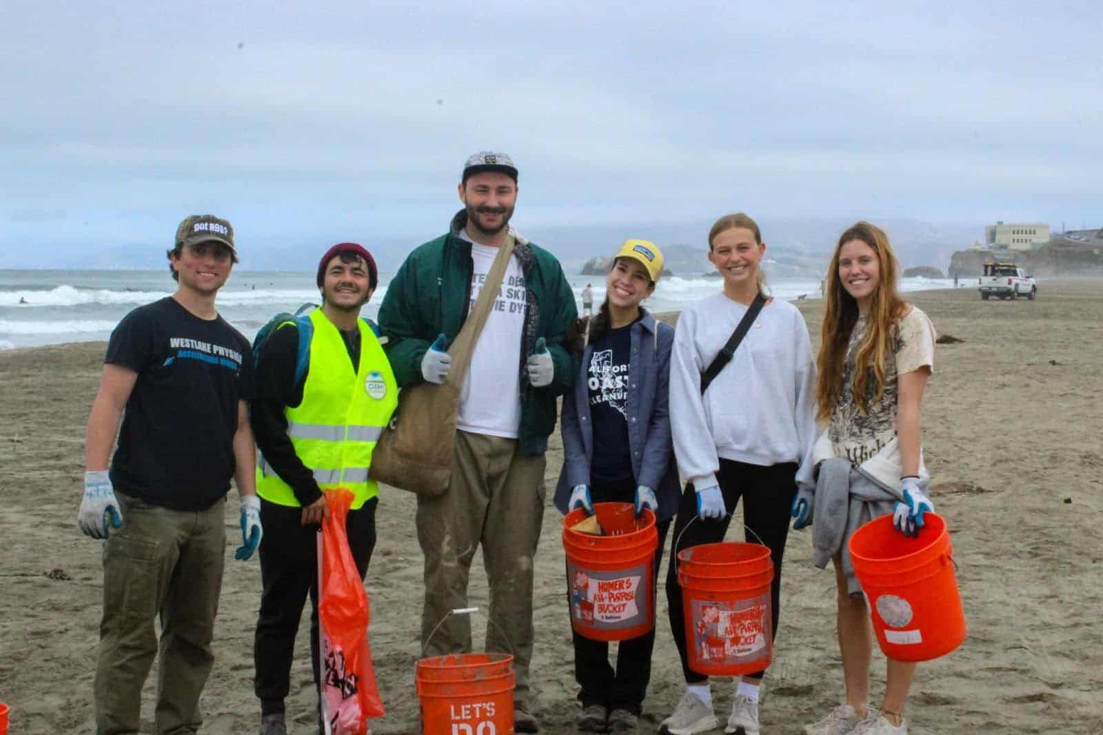 Oceanic Society volunteers standing on San Francisco’s Ocean Beach with garbage buckets during International Coastal Cleanup Day.